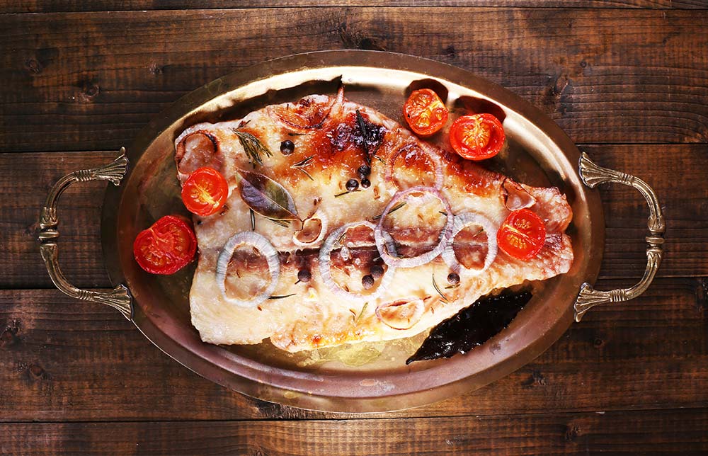 Pangasiusfilet gebacken mit Cherrytomate und Zwiebeln